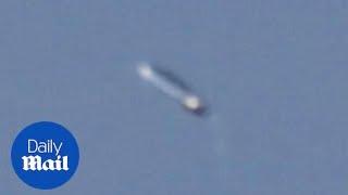 Photographer captures 'pill-shaped' UFO in the sky!!