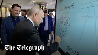 Putin draws bizarre smiley face on electric whiteboard in Moscow