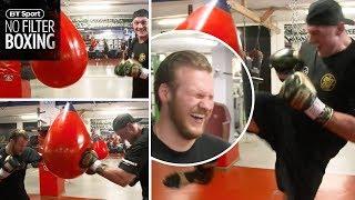 Illegal knees!  Tyson Fury and Ben Davison smash the bag together in Marbella gym