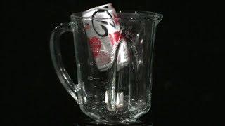 Slow Motion Exploding Soda Can dropped in Blender caught in High Definition HD Slow Mo Video Camera