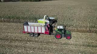 Aerial Perspectives of Custom operators harvesting cob meal