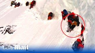 Tragic moment climbers pass a dying Pakistani porter on K2 - the world's second highest mountain