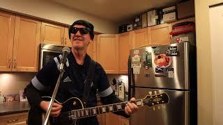 "The Only Thing That Looks Good On Me" - just a guy in his kitchen trying to play Bryan Adams!