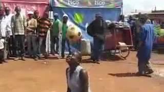 African woman performing football warm up