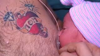 Dad helps out with 'breastfeeding' newborn