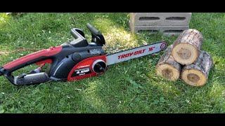 Troy bilt 16" 4.5 hp electric chainsaw at work