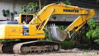 Good Job..!! Komatsu PC210 Excavators make new paths for other heavy equipment to pass through.