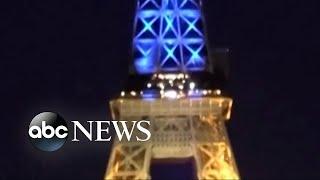 Eiffel Tower lights up blue and yellow in solidarity with Ukraine l ABC News