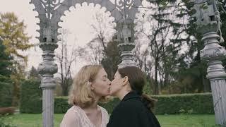 lesbian couple kissing in the park