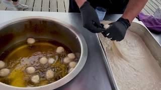 Street food delicious handmade donuts (Greek Loukoumades)