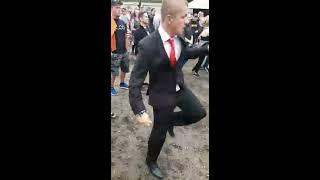 Guy looks out of place wearing a suit to a festival, until the beat drops | CONTENTbible