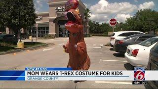 Dino Mom wears costume for kids