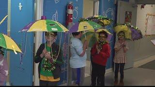 Athens' Spark Academy holds Mardi Gras bash