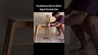 Guy Balances Chair on All Four Legs at The Same Time