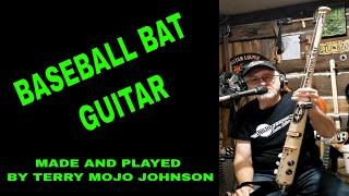 Baseball Bat Guitar built & played by Terry Mojo Johnson of Mojo Johnson Guitars.