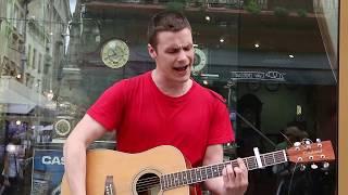 Street musician singing cover on "Queen - Bohemian Rhapsody" in Lviv