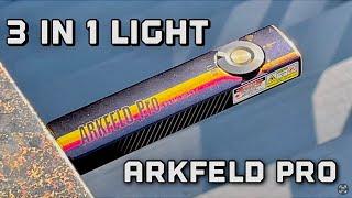 The do all flashlight Olight Arkfeld pro racing stripes with white UV laser light