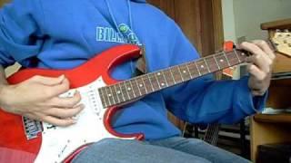 Strumming basic open chords on guitar