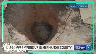 Large hole opens in ground on Brooksville property