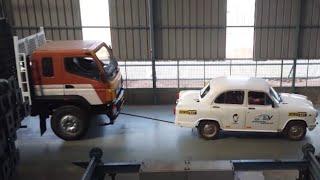 Electric Ambassador Car pulls 14.5 Ton Bharat Benz Truck