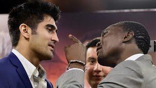 Indian boxer Vijender Singh (L) with Francis Cheka during a press conference, in New Delhi