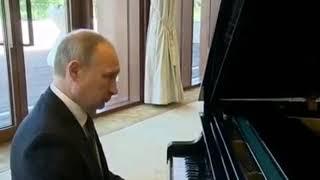 Putin Plays Soviet March on the Piano