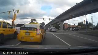 Insane Yellow Cab driver risks bicyclist life in illegal shoulder pass Vancouver