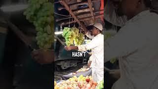 Fruit Vendor Protects His Grapes  (Bangladesh)