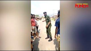 Soldier Advises Crowd Not To Loot From Abuja NYSC Camp | Punch