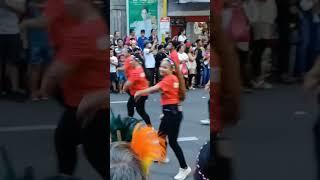 parade of lights performing dance in street