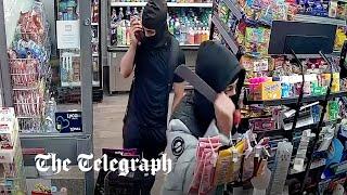 Moment have-a-go hero shopkeeper traps machete-wielding robbers inside shop