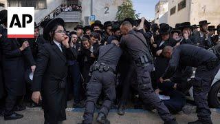 Ultra-Orthodox Jewish men protest against mandatory enlistment in the army