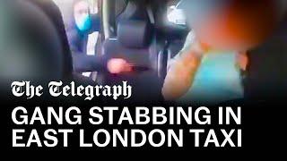 Terrifying moment man is stabbed by knife-wielding gang in the back of a taxi