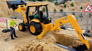 Kendaraan konstruksi excavator mobil truk mainan di tempat kerja