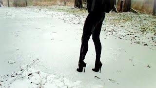 Extreme walking on snow, open slippery shoes with high heels and thin soles