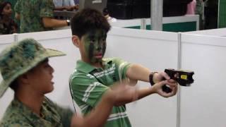 Army Open House '09 - Boy using Taser Gun