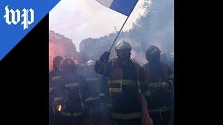 French march for workers' rights in May Day protests