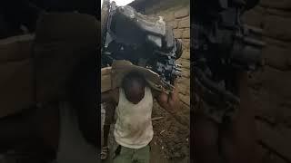 Kenyan Superman lifts and carries a huge truck engine