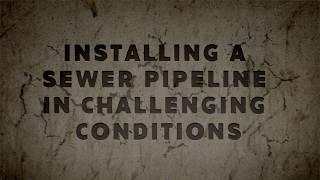 Installing a sewer pipeline in challenging conditions