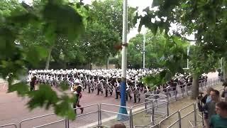Massed Bands of HM Royal Marines marching on the Mall after Beating Retreat 2024