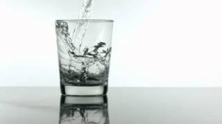 slow motion pouring glass of water