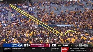 Arizona State fans storm the field before the game is over and take goalposts down vs BYU