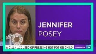 Woman accused of pressing hot pot against child's arm as punishment