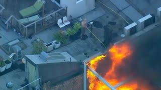 Fire burns on rooftop of building in SoHo