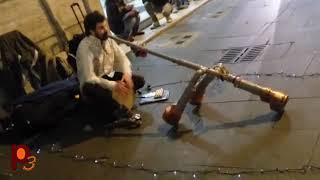 Street Musician - Guy playing pipes in the streets of the world.