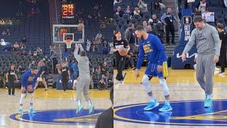 Steph Curry and Luka Doncic half court shooting contest before the game 