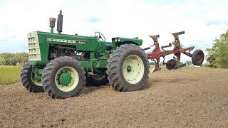 Oliver 1800 C Series Tractor with FWA plowing with roll over plow