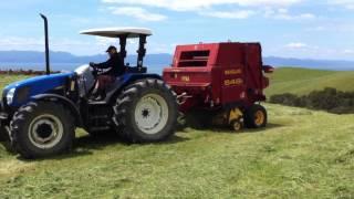 New Holland baling with a New Holland 648 round baler