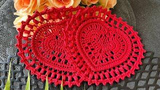 Crocheted coaster for a cup, in the shape of a heart