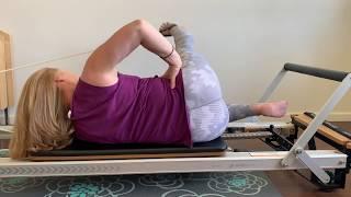 Reformer side lying feet in straps 1